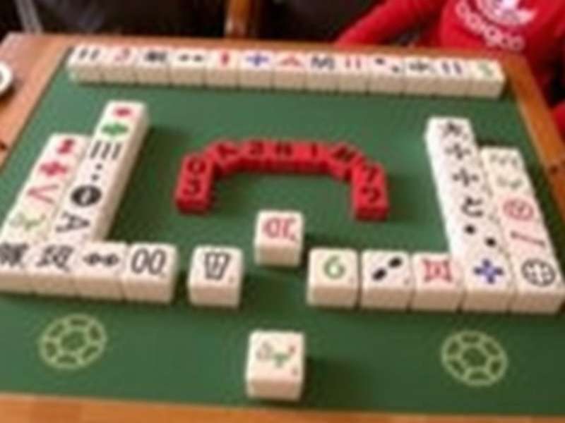 Group of Indian seniors enjoying a Mahjong game together